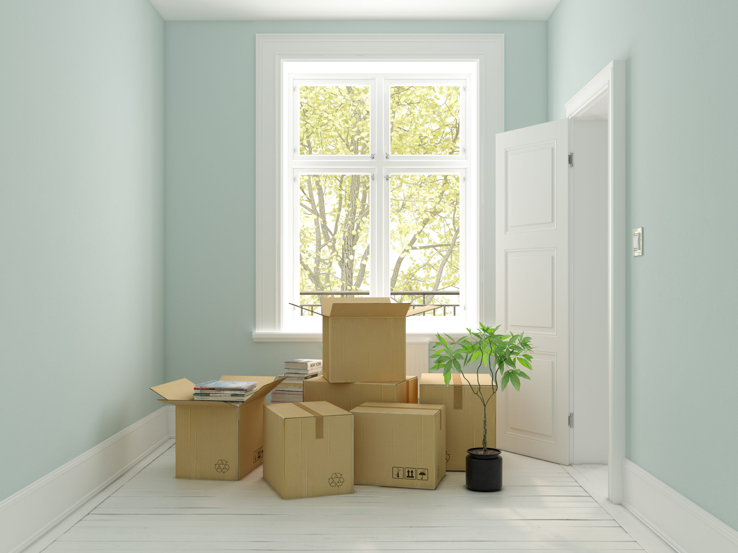 interior-with-packed-cardboard-boxes-for-relocatio-2021-08-26-18-15-31-utc-scaled.jpg